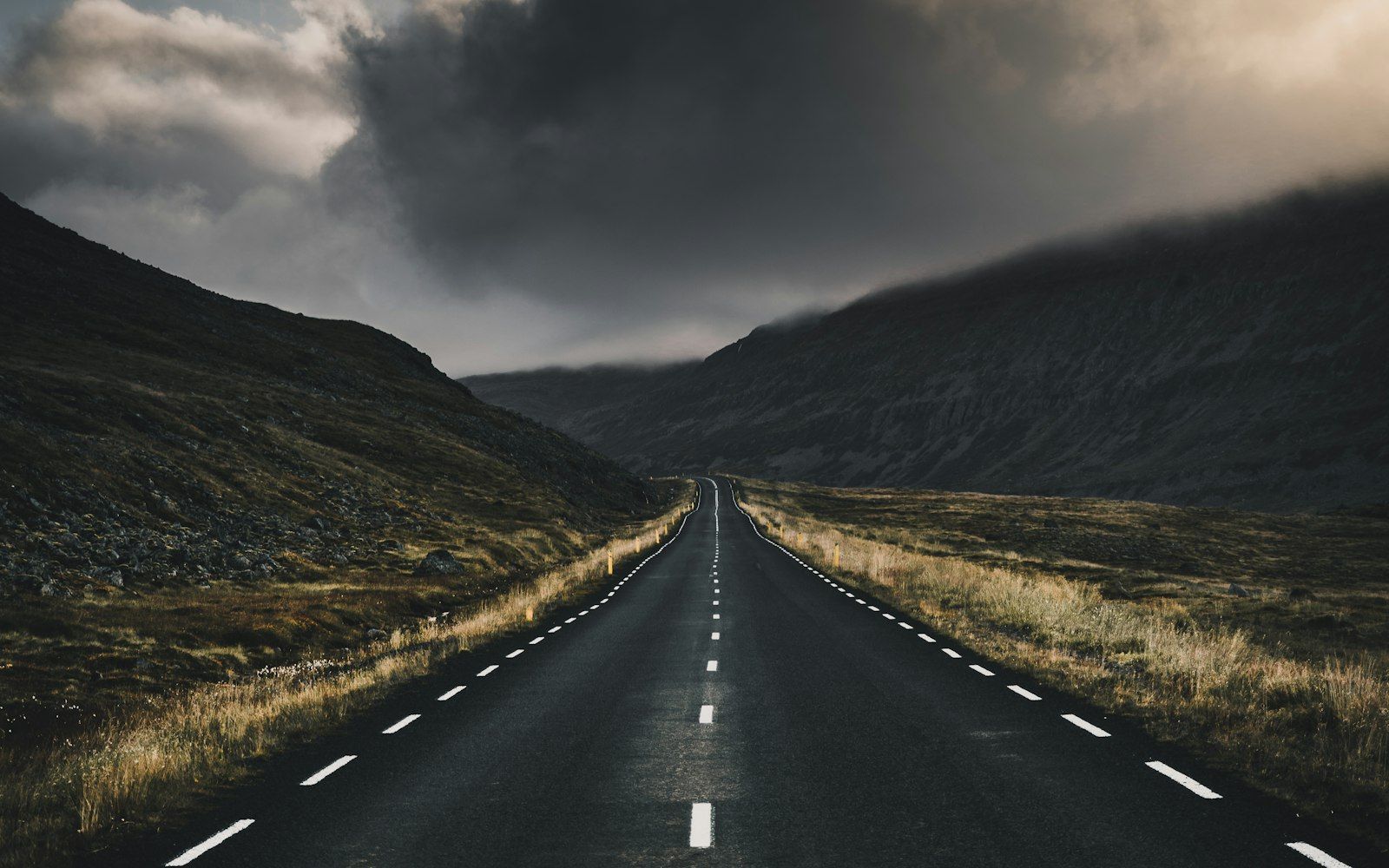 Coach touring a mountain road in the Icelandic highlands