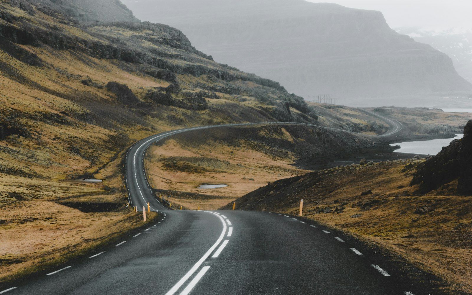 Aerial view of an Icelandic Ring Road winding through mountains